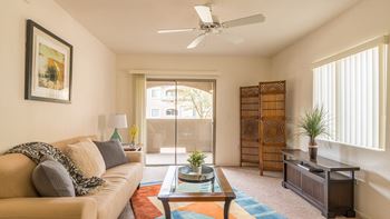 Desert Sands living room with ceiling fan. 